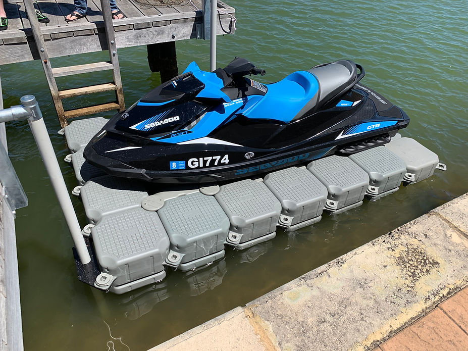 A jet ski is securely parked on a floating dock, ready for the next adventure on the water.