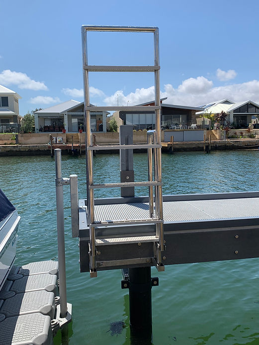 A floating boat dock featuring a sturdy ladder for easy access to and from the water.